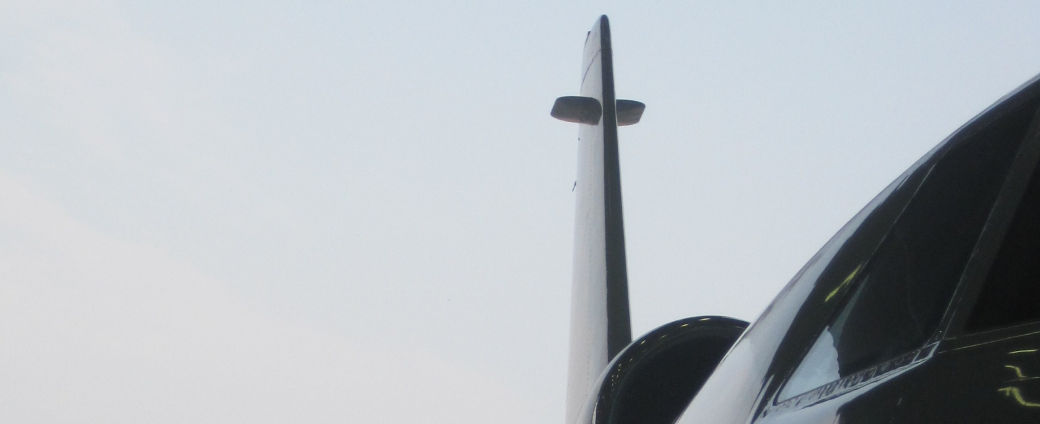 Business jet tail section detail on the apron during ground operations